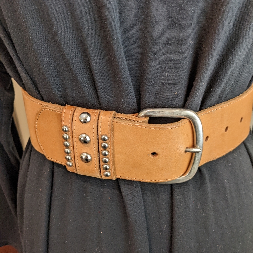 Tan leather belt with silver buckle